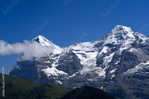 Jungfraujoch with research station Sphinx at Bernese highland on a sunny summer day with blue sky background. Photo taken July 20th, 2021, Lauterbrunnen, Switzerland.