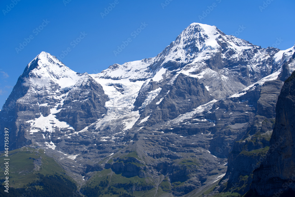 Obraz premium Peak Mönch (Monk) at Bernese highland on a sunny summer day with blue sky background. Photo taken July 20th, 2021, Lauterbrunnen, Switzerland.