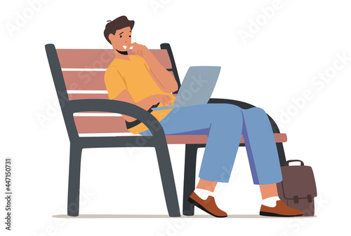 Young Man Sitting on Bench in Park with Laptop in Hands and Communicating Online in Internet. Social Media Networking