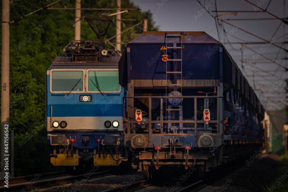 Trains and whistle stop Olesko in central Bohemia in sunset orange evening Trains and whistle stop Olesko in central Bohemia in sunset orange evening