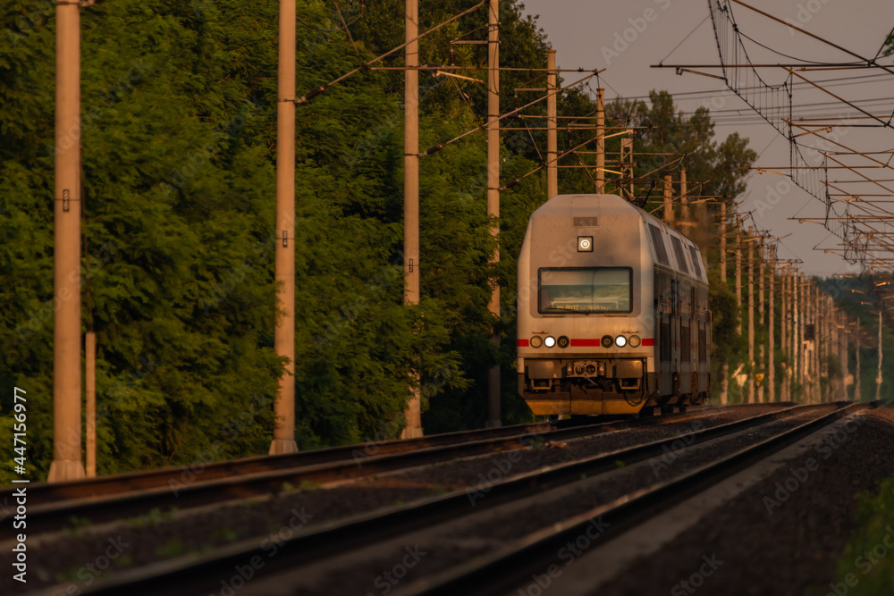 Fototapeta premium Trains and whistle stop Olesko in central Bohemia in sunset orange evening