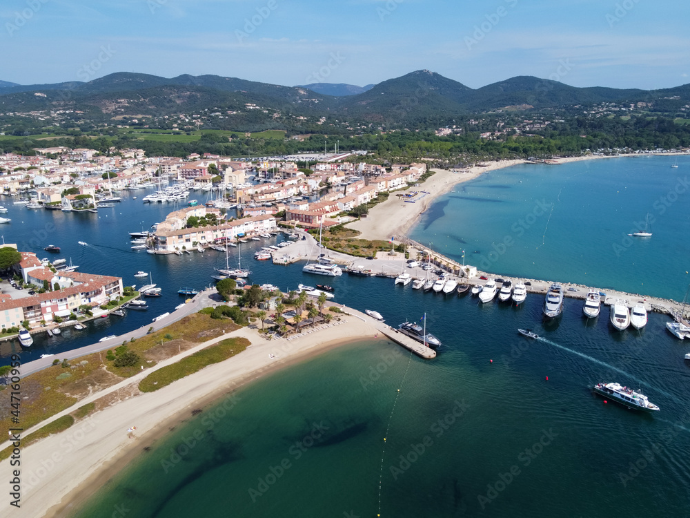 Aerial view on small houses and sailboats of Port Grimaud and port Cogolin, French Riviera, Provence, France
