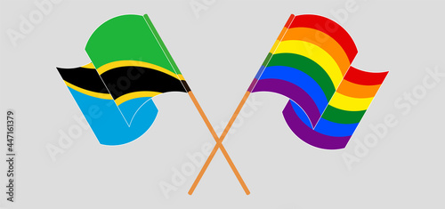 Crossed and waving flags of Tanzania and LGBTQ
