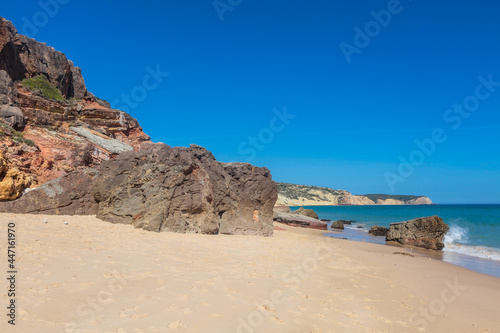 Atlantic coast with stones, sand and clear water.