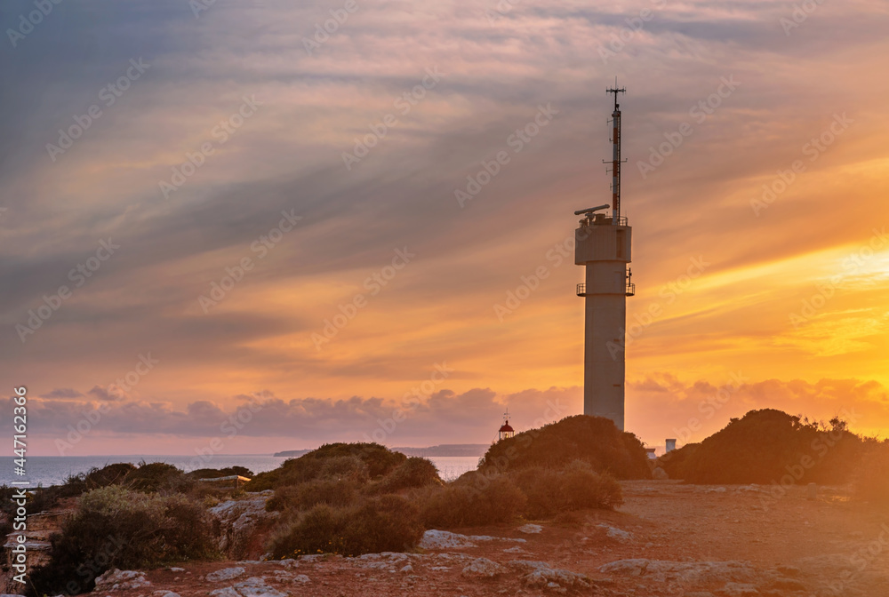 Lighthouse of Ponta do Altar on sunset sky background