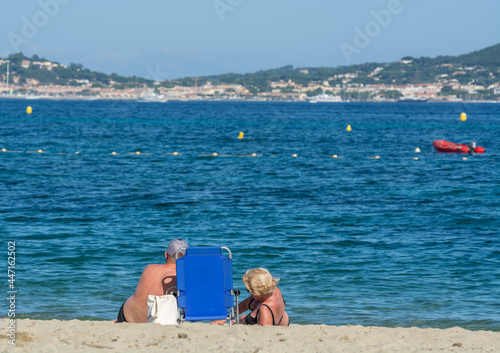 Undentified people sunbathing on sandy beach on French Riviera, Var, France photo