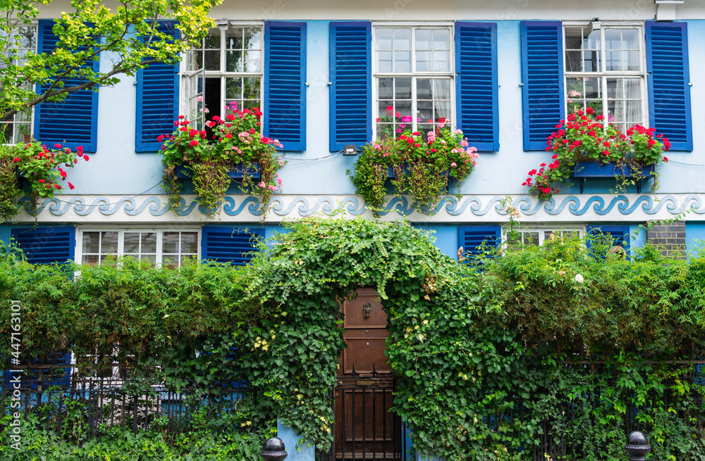 Blue windows and wave pattern on a townhouse in central London