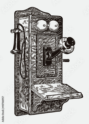 Antique wooden wall mounted telephone from the early 20th century