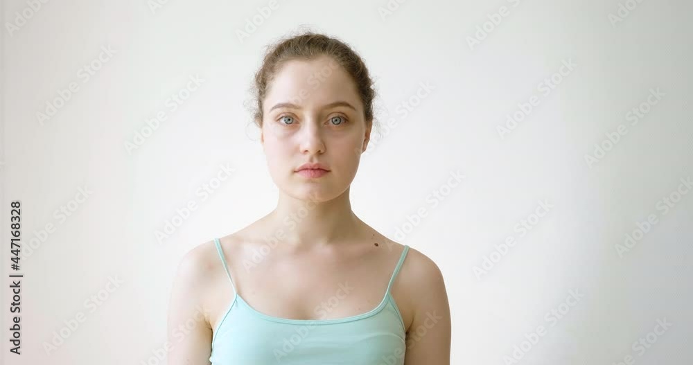 A young girl says no and gestures with her hand. A young girl says no and gestures with her hand.
