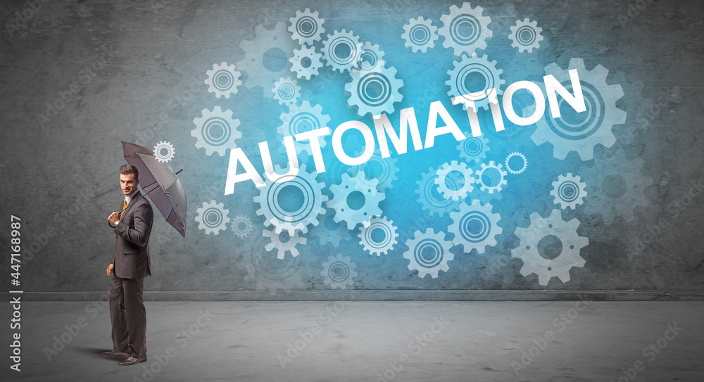 Fototapeta premium Businessman defending with umbrella