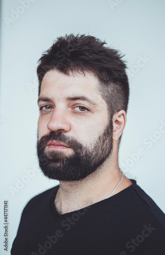 Handsome beard man, outdoor hipster portrait, black t-shirt, street, brutal macho boy