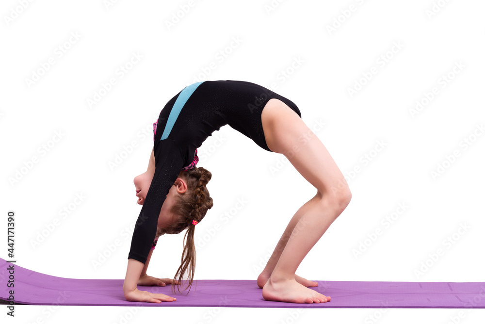 Cute child girl making Gymnastic exercises against white background ...