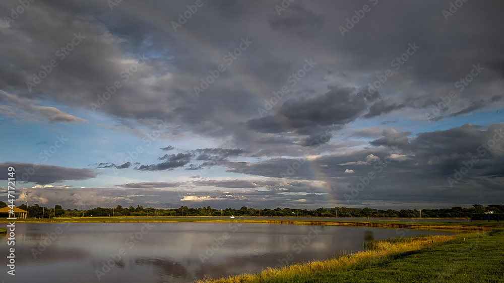 Fototapeta premium Clouds and rainbow