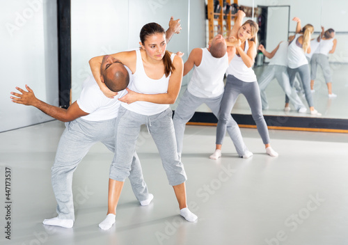 Athletic woman doing strength techniques in self defense training