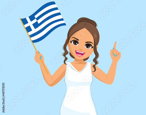 Beautiful young happy Greek woman waving Greece Flag on blue background and pointing finger up gesture
