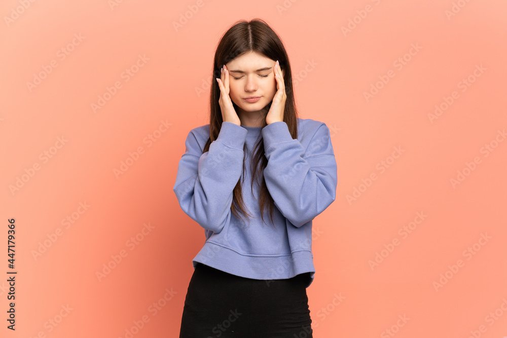 Young Ukrainian girl isolated on pink background with headache Young Ukrainian girl isolated on pink background with headache