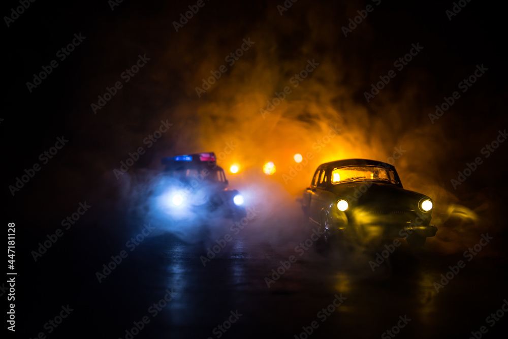 Police car chasing a car at night with fog background. 911 Emergency response police car speeding to scene of crime.