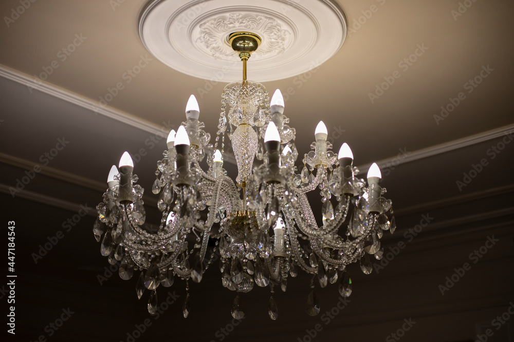 Glass chandelier. Ceiling light source.