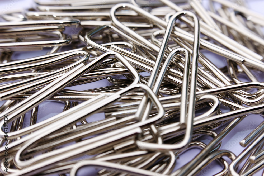 Close up paper clip on white background, and macro paper clip, office equipment Close up paper clip on white background, and macro paper clip, office equipment