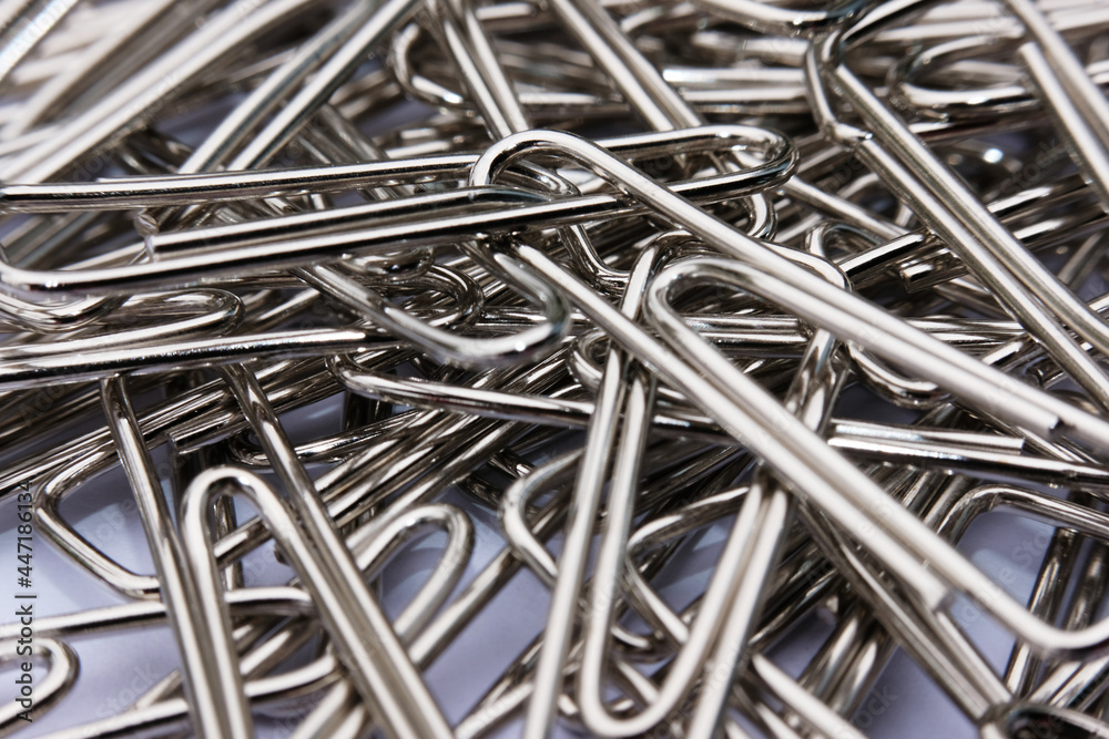 Close up paper clip on white background, and macro paper clip, office equipment Close up paper clip on white background, and macro paper clip, office equipment