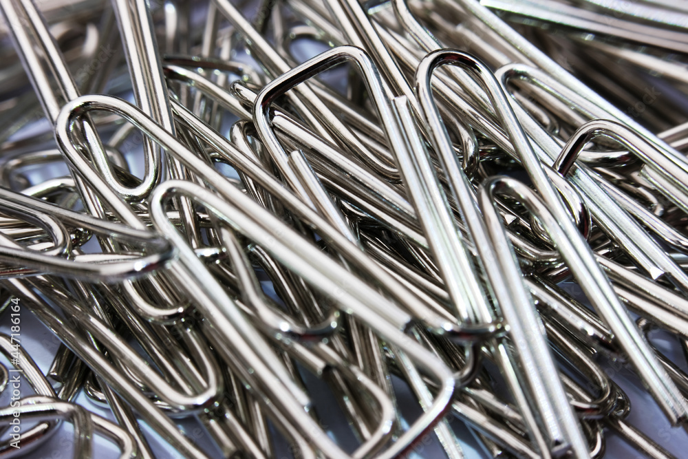 Close up paper clip on white background, and macro paper clip, office equipment Close up paper clip on white background, and macro paper clip, office equipment