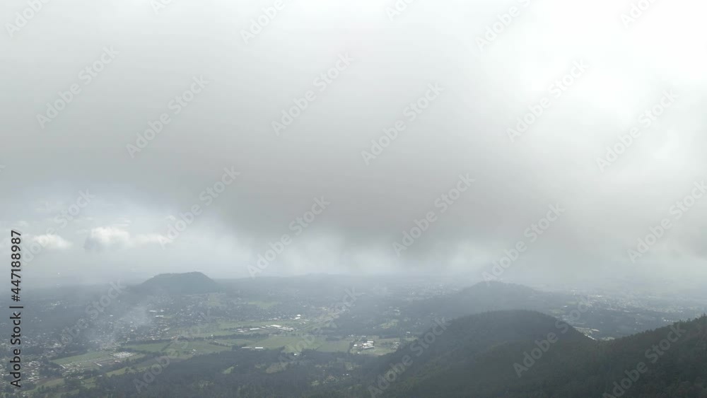 Slowly pull front above mountains in a foggy day Slowly pull front above mountains in a foggy day