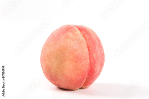 Ripe peach fruit close-up on white background