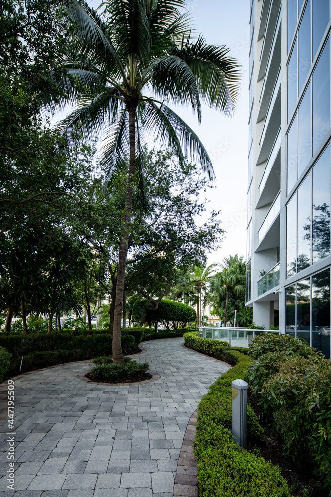 Pedestrian path in the city near highrise buildings Pedestrian path in the city near highrise buildings