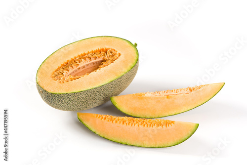 close-up of cut fresh Hami melon fruit isolated on white background.