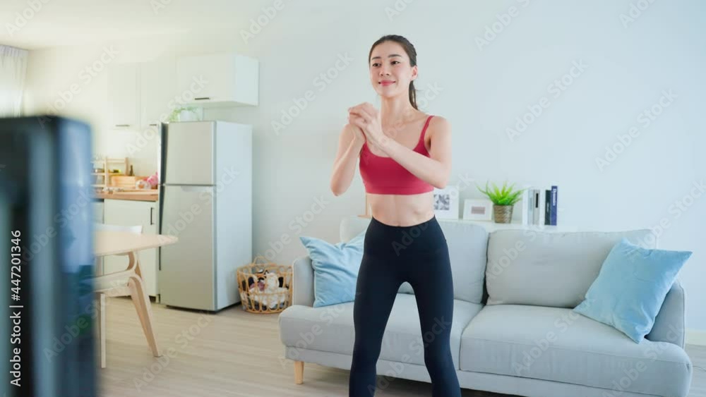 Asian Beautiful young woman stay home, doing aerobic exercise at home. Asian Beautiful young woman stay home, doing aerobic exercise at home.
