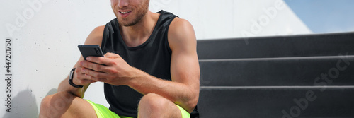 Man using phone connected to fitness smartwatch health monitoring of body and sports data from exercising. Active healthy people lifestyle banner panoramic crop of smartphone and smart watch. photo