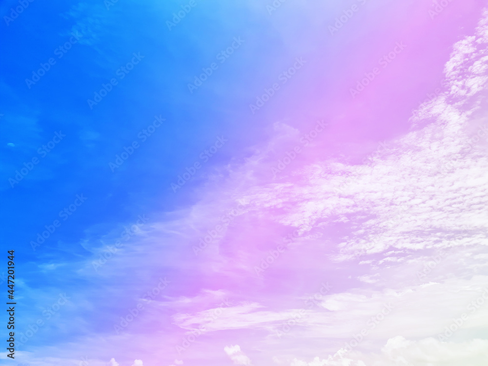 Multicolored pastel sky and free floating clouds