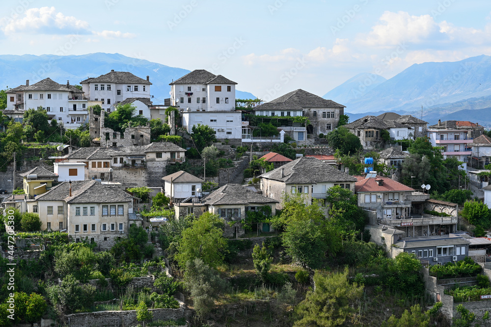 View of the old town of Gjirokastra in Albania with the traditional stone roofs, stone house roof	