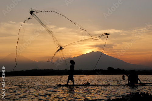 fisherman throwing nets