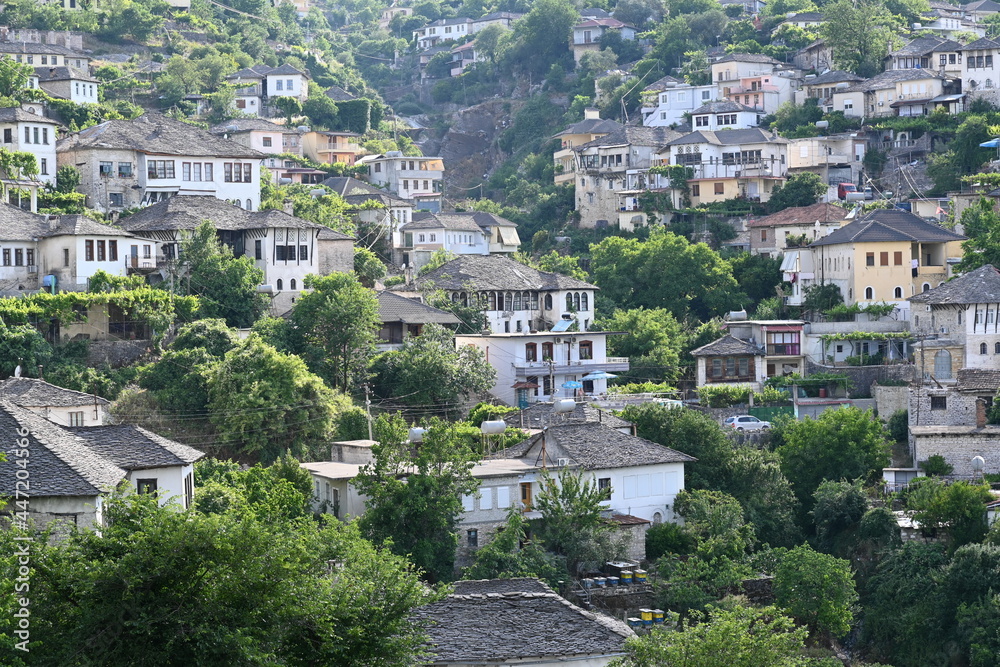 Fototapeta premium View of the old town of Gjirokastra in Albania with the traditional stone roofs, stone house roof