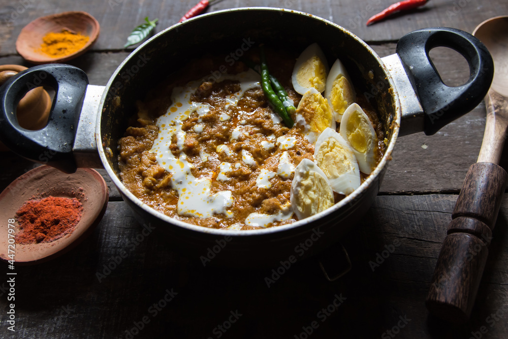 Chicken bharta prepared with shredded chicken, eggs, butter, cream along with Indian spices. A spicy rich gravy chicken dish. Close up. Chicken bharta prepared with shredded chicken, eggs, butter, cream along with Indian spices. A spicy rich gravy chicken dish. Close up.