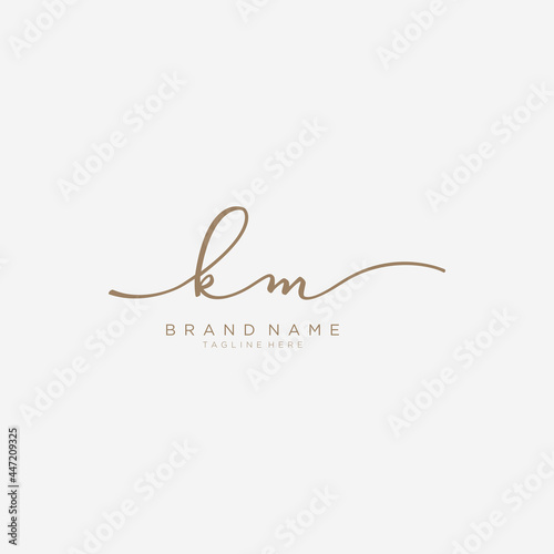 Letter KM gold Initial handwriting design logo template.