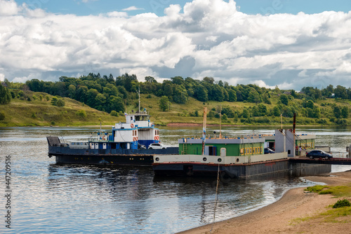 A river car ferry prepares for loading before the departure of tourists and locals across the Volga River in the city of Tutaev