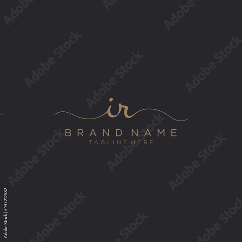 Letter IR gold Initial handwriting logo vector. Black background.