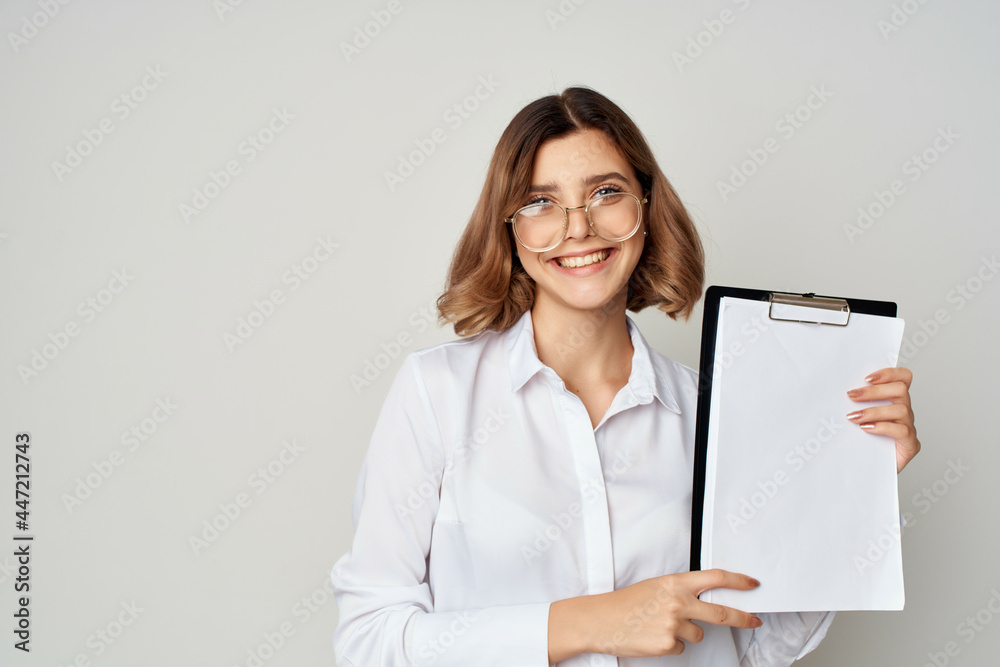 Business woman in white shirt with documents in hands emotion work success Business woman in white shirt with documents in hands emotion work success
