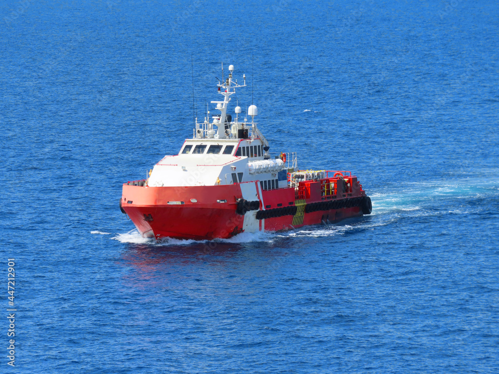 Supply boat transfer the cargo for supporting  oil and gas industry and moving cargo from the boat to the platform. Boat is waiting transfer cargo and crews to platform.