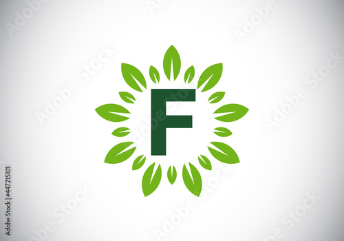 Initial F monogram letter alphabet with leaf wreath. Green leaf, flower logo design concept. Modern vector logo design for business, and company identity.
