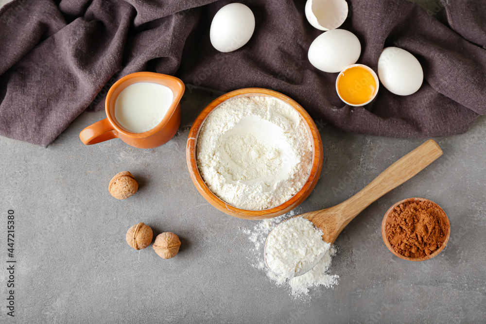 Ingredients for preparing bakery on grey background Ingredients for preparing bakery on grey background