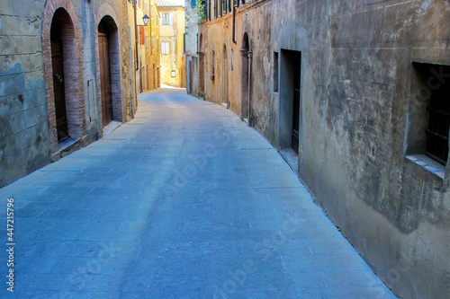 Narrow street in historic center of  Montalcino town, Val d'Orcia, Tuscany, Italy © donyanedomam