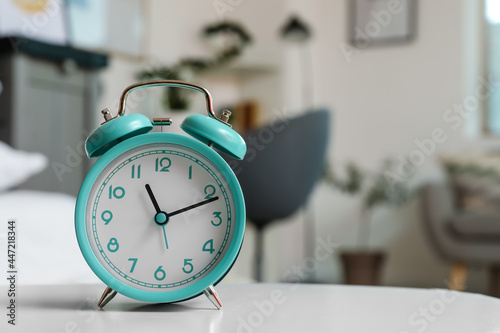 Alarm clock on table in room, closeup
