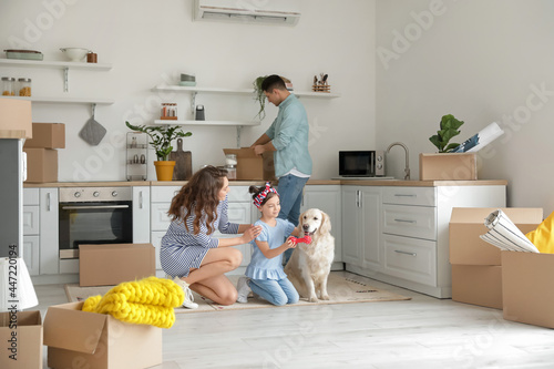 Happy family with dog and b...