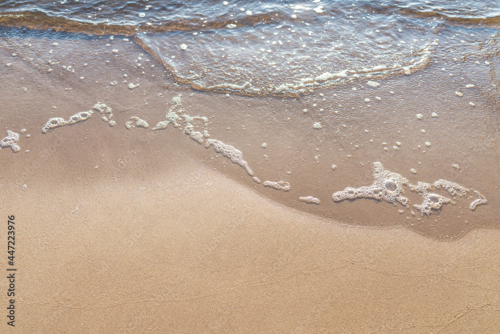 Soft wave of the sea on the sandy beach.Soft focus,blurred image.