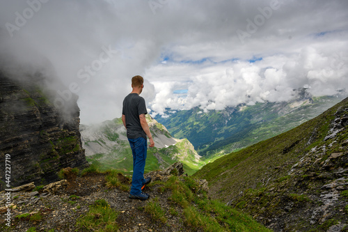 hiker enjoying the view near Hochstollen in Hasliberg