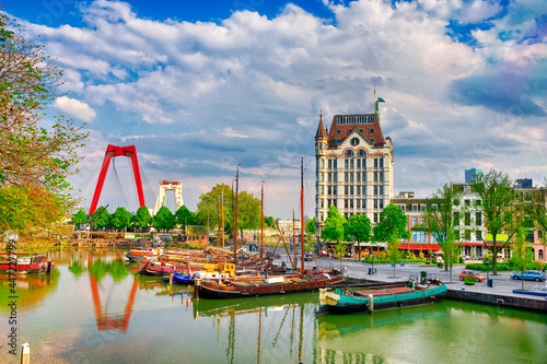 Dutch Destination. Cityscape of Rotterdam with Railway Transportation Bridge in Background and Small Sailboats in Foreground In Port and Harbour.