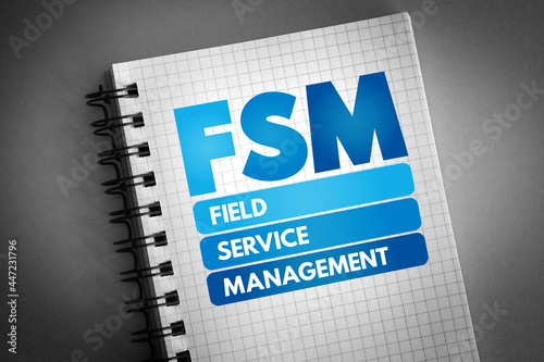 FSM - Field Service Management acronym on notepad, business concept background photo